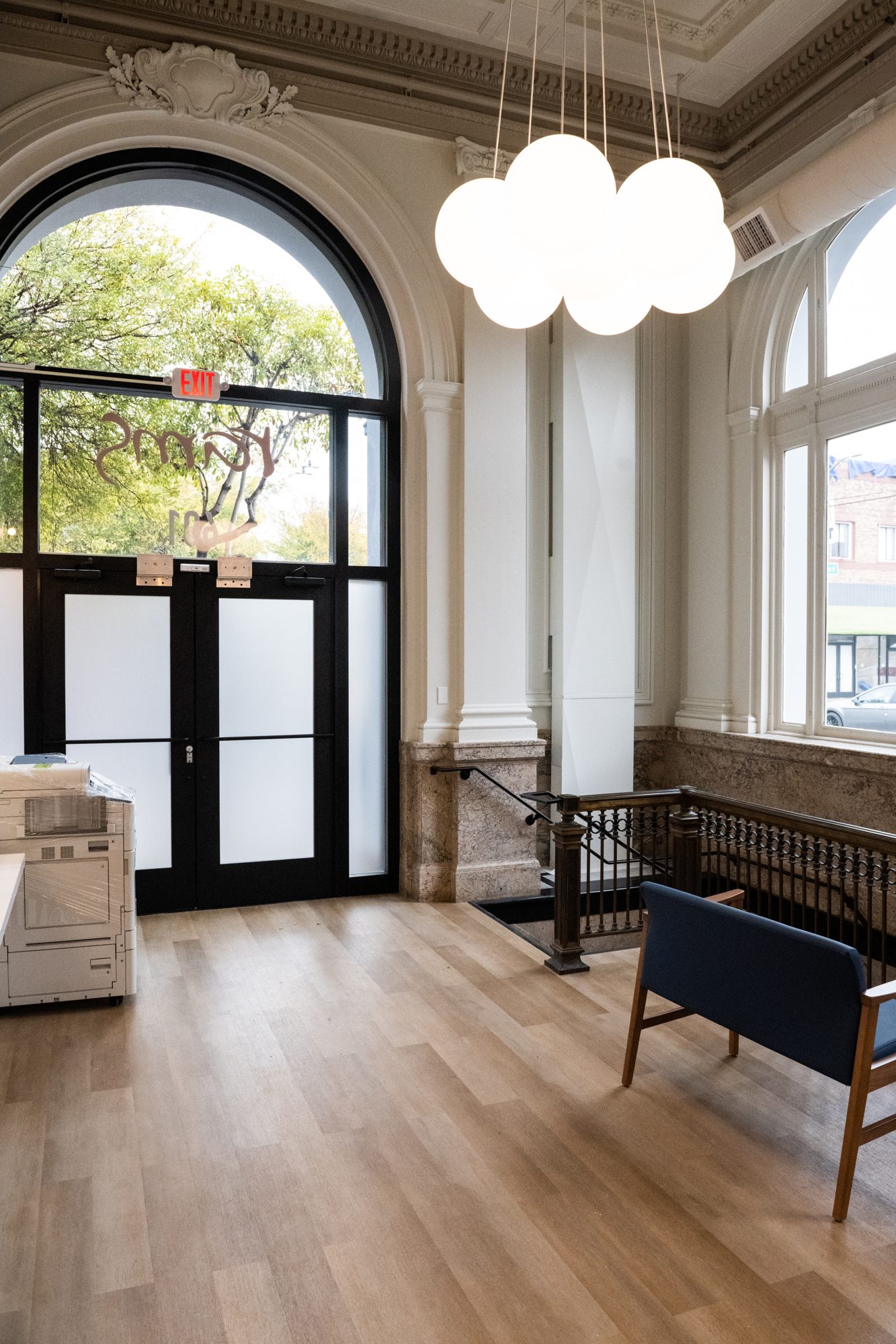 Front entry with the historic doors and bench