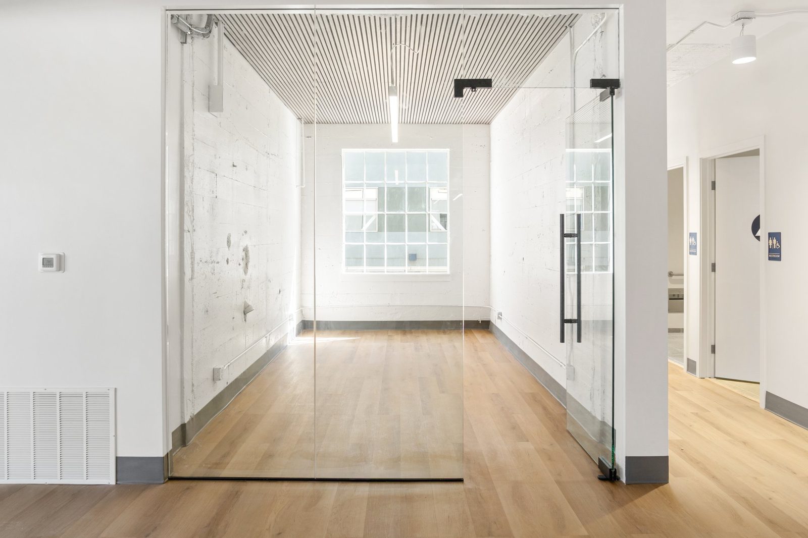Glass-front conference room at 350 Brannan St