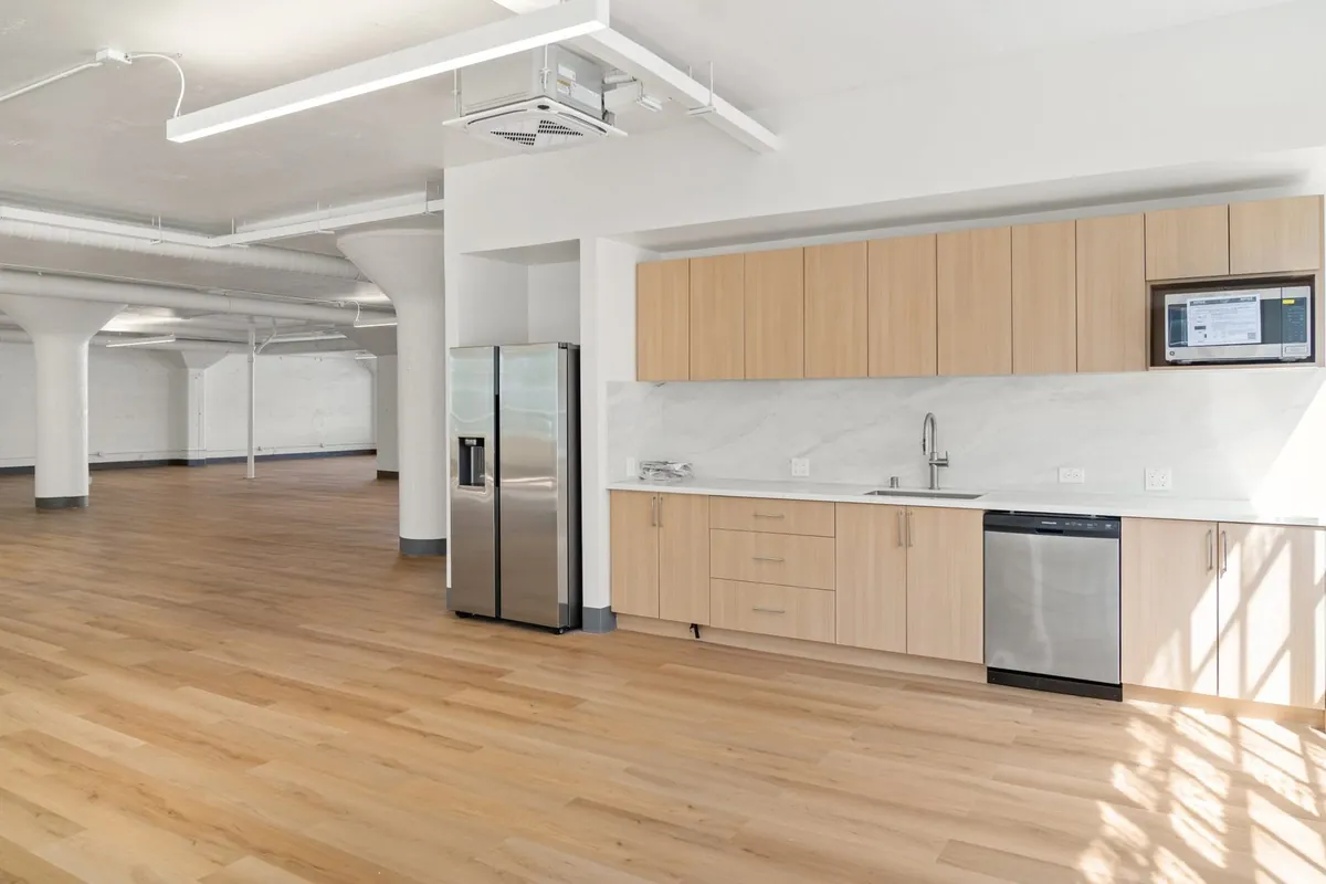 Kitchenette at the edge of the open office floor