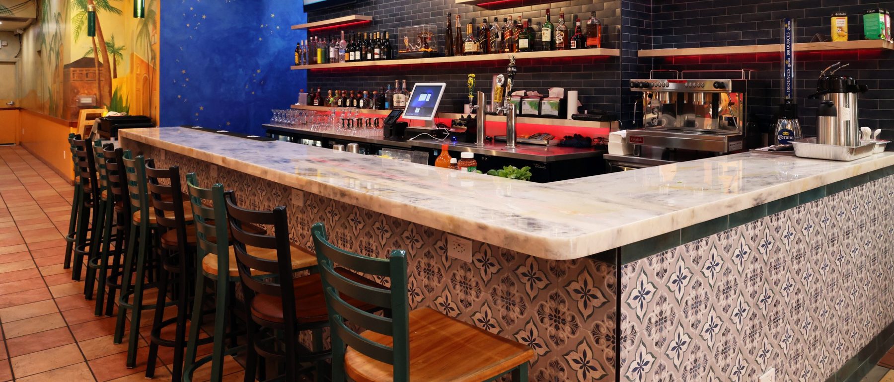 Marble-top bar with patterned tile front at 2731 Mission St