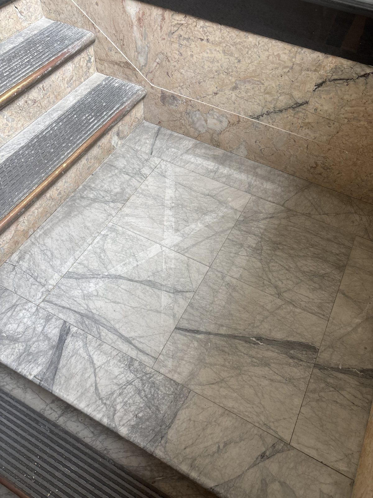 Original marble stair and wainscot at 601 Clement St
