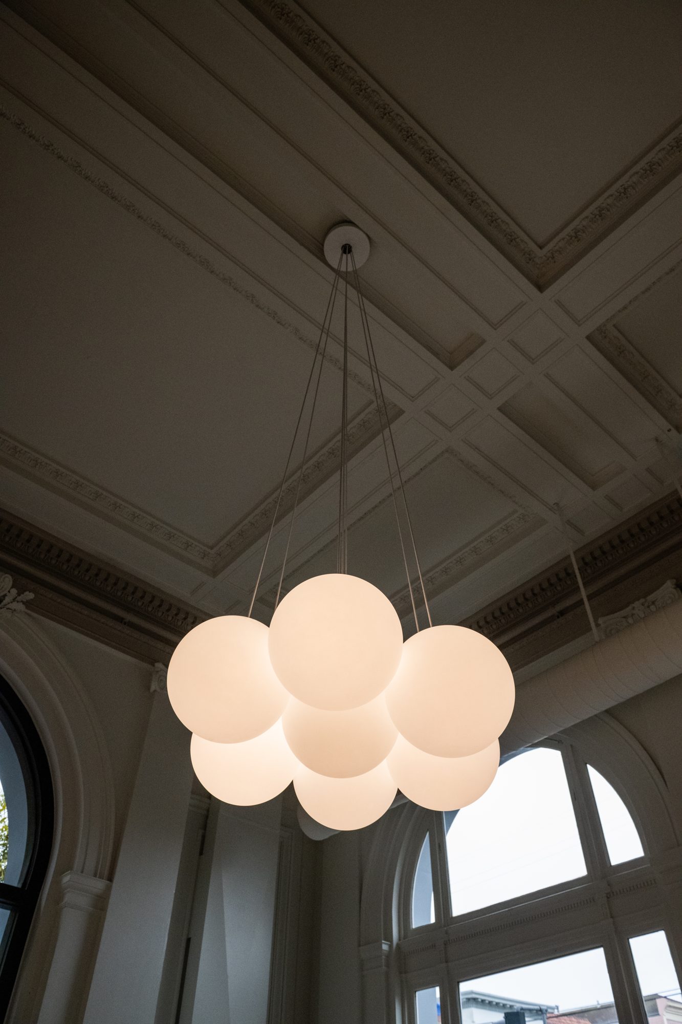 Plaster coffered ceiling and new globe pendant cluster at 601 Clement St